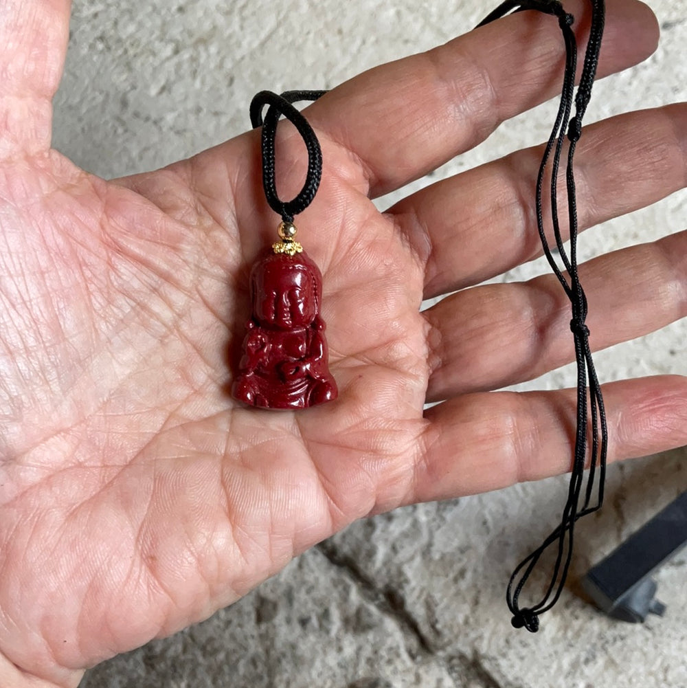 Cinnabarite Buddha Pendant on Black Cord