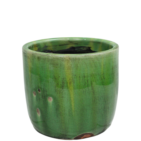 Green ceramic pot on a white background